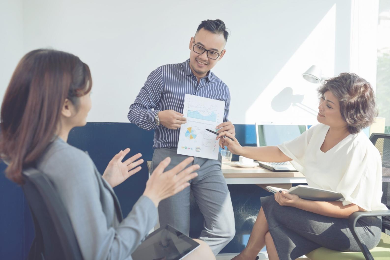Marketing professionals collaborating in a modern workspace